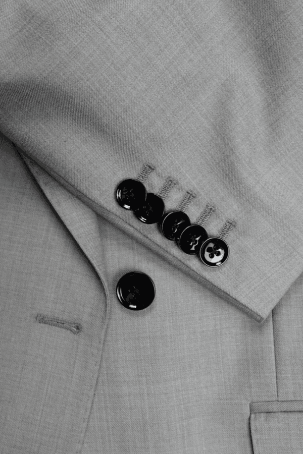 Grey suit Peak lapel buttons